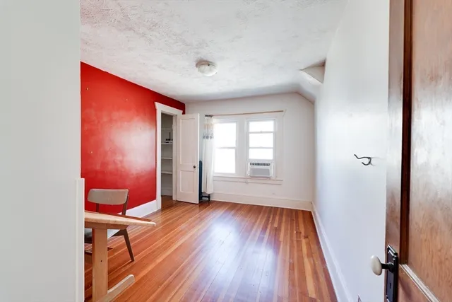 a room with furniture and wooden floor