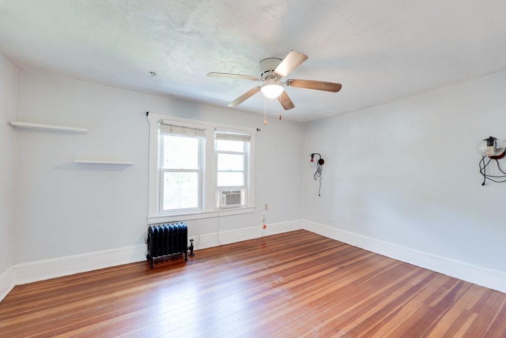 60 Blake Street Springfield, MA 01108 - Photo 16 of 30 wooden floor in an empty room with a window