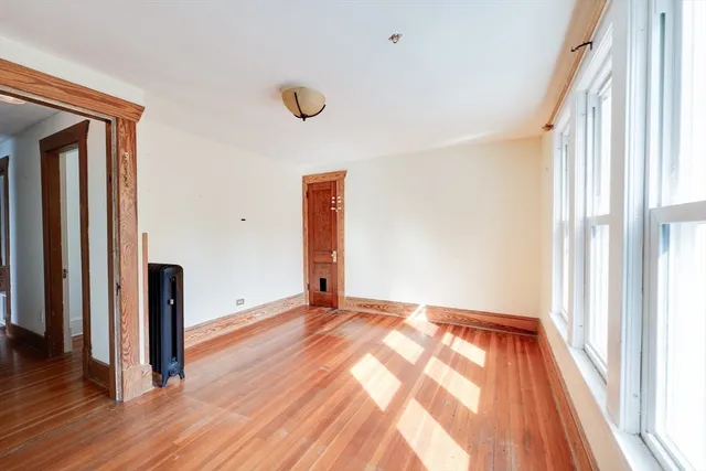 a view of a hallway with a wooden floor