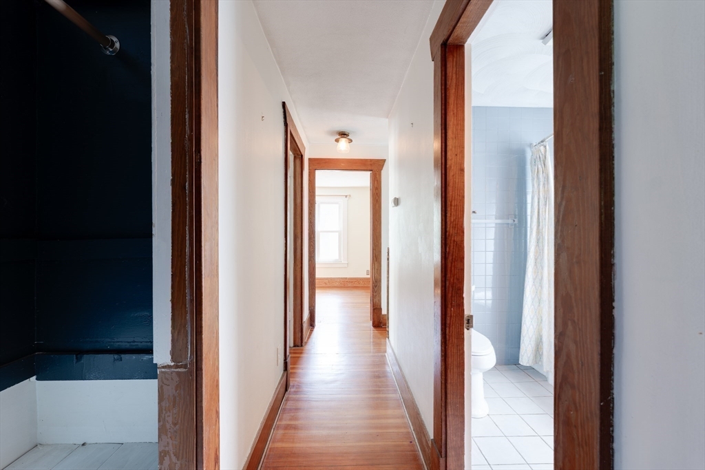 60 Blake Street Springfield, MA 01108 - Photo 20 of 30 a view of a hallway with a wooden floor