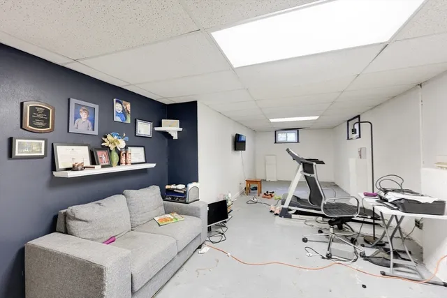 a view of a house with a bench in a patio