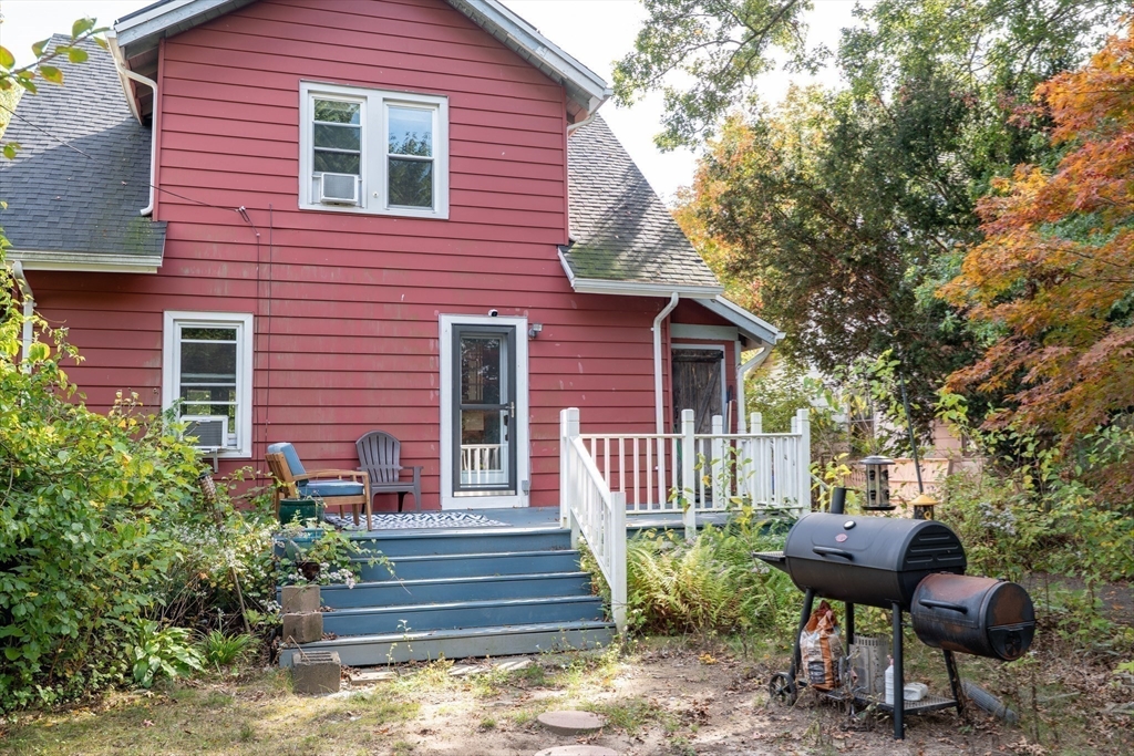 60 Blake Street Springfield, MA 01108 - Photo 22 of 30 a view of a house with a bench in a patio