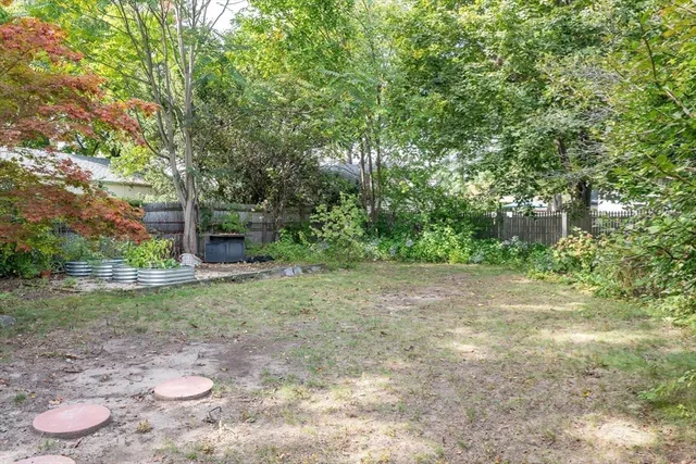 a view of a patio with wooden floor and outdoor seating