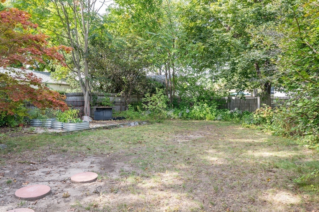 60 Blake Street Springfield, MA 01108 - Photo 23 of 30 a view of a backyard with large trees