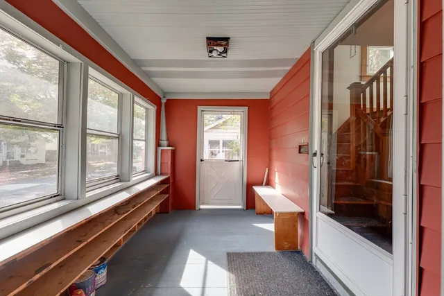 a view of a patio with a table chairs and a porch