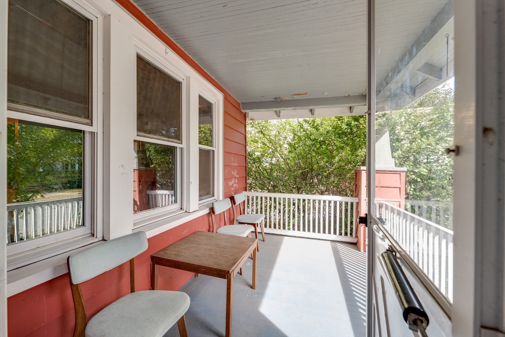 60 Blake Street Springfield, MA 01108 - Photo 30 of 30 a view of a patio with a table chairs and a porch
