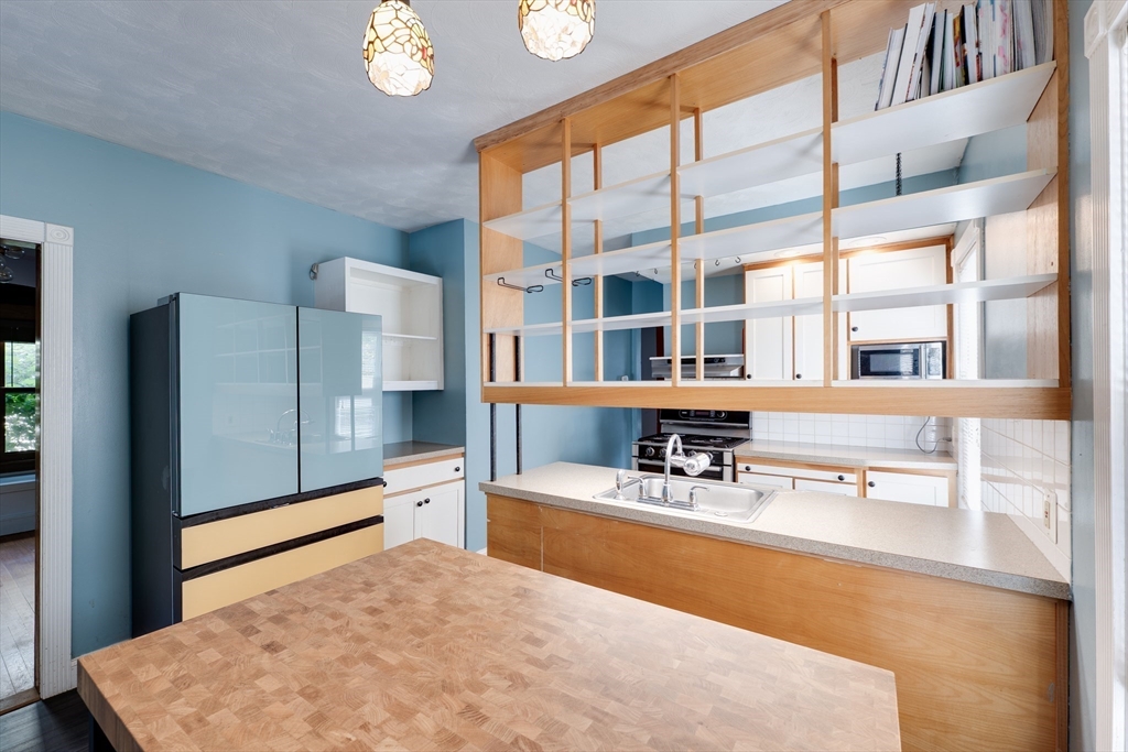 60 Blake Street Springfield, MA 01108 - Photo 10 of 30 a living room with furniture and large windows