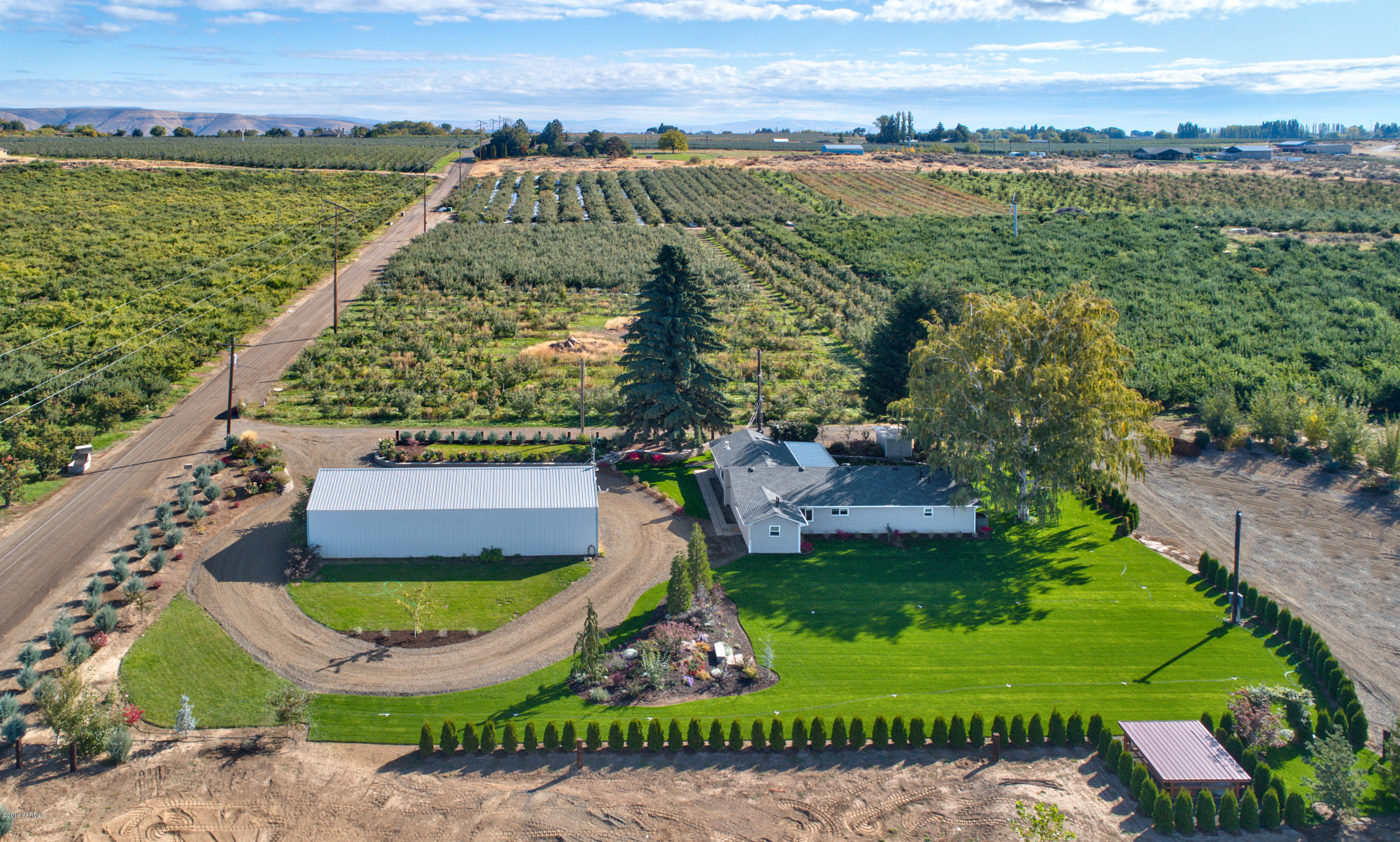 250 Rudd Road Tieton, WA 98947 - Photo 2 of 29 an aerial view of a house having outdoor space