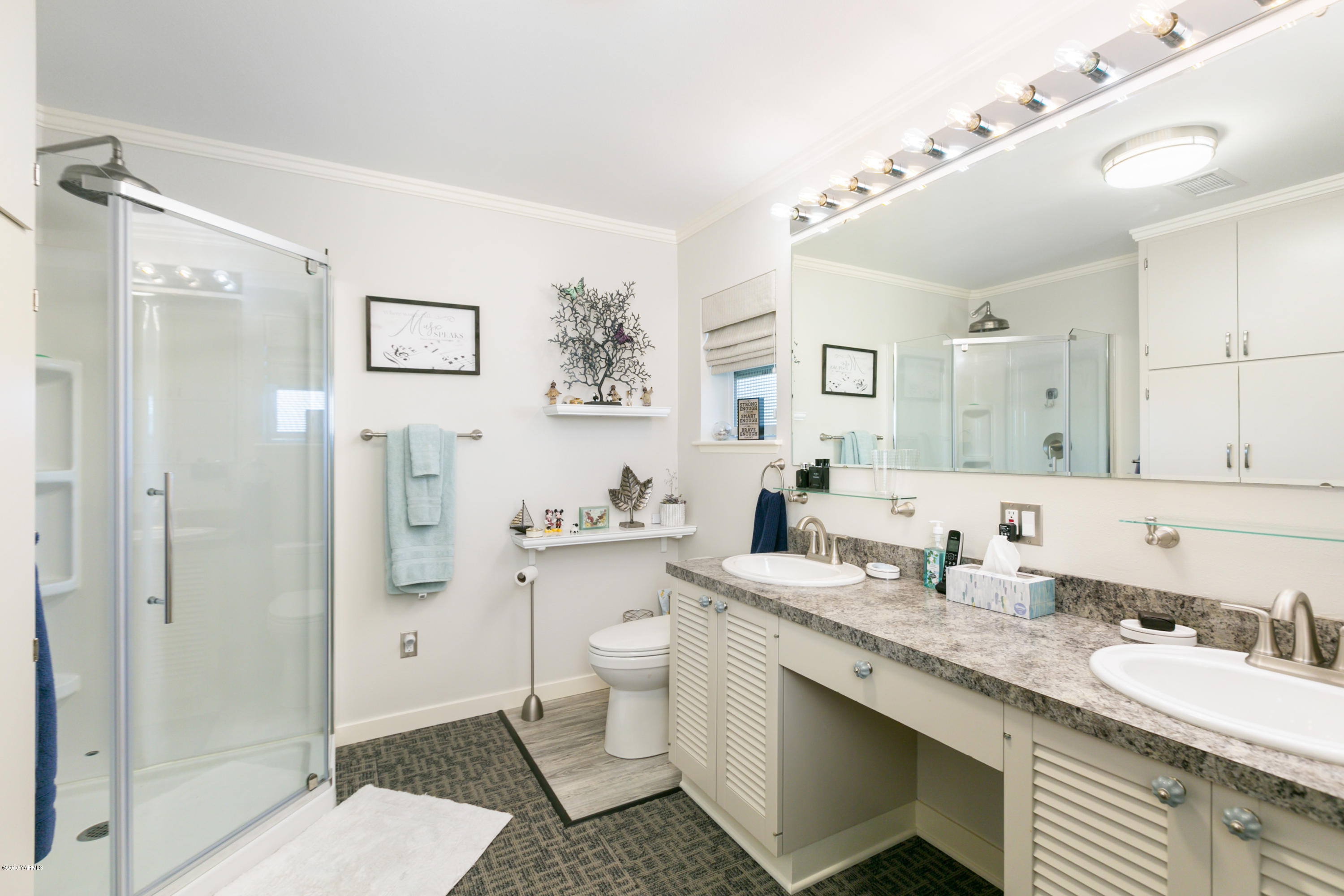 250 Rudd Road Tieton, WA 98947 - Photo 11 of 29 a bathroom with a granite countertop sink mirror vanity and toilet