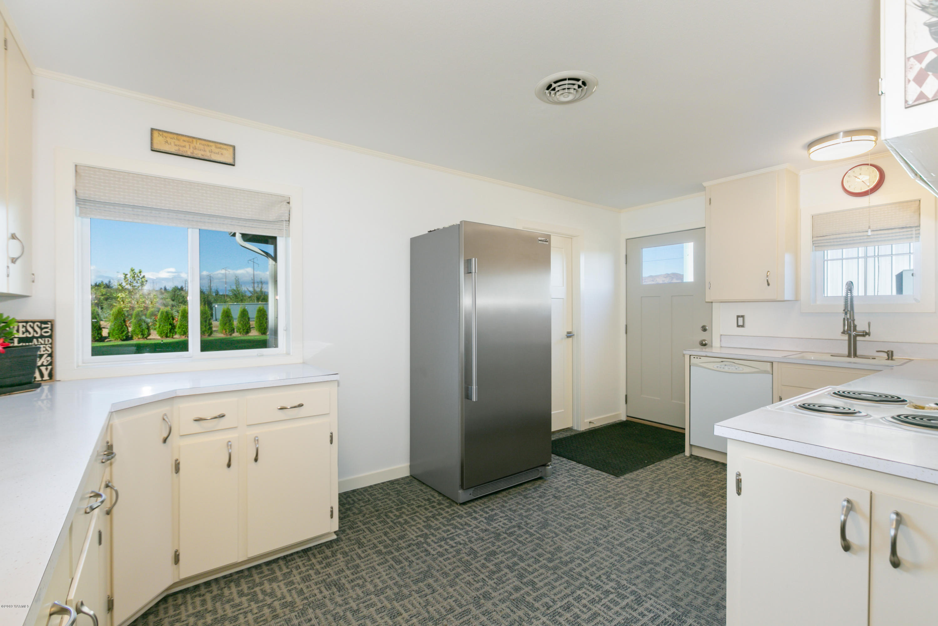 250 Rudd Road Tieton, WA 98947 - Photo 14 of 29 a kitchen with white cabinets and sink