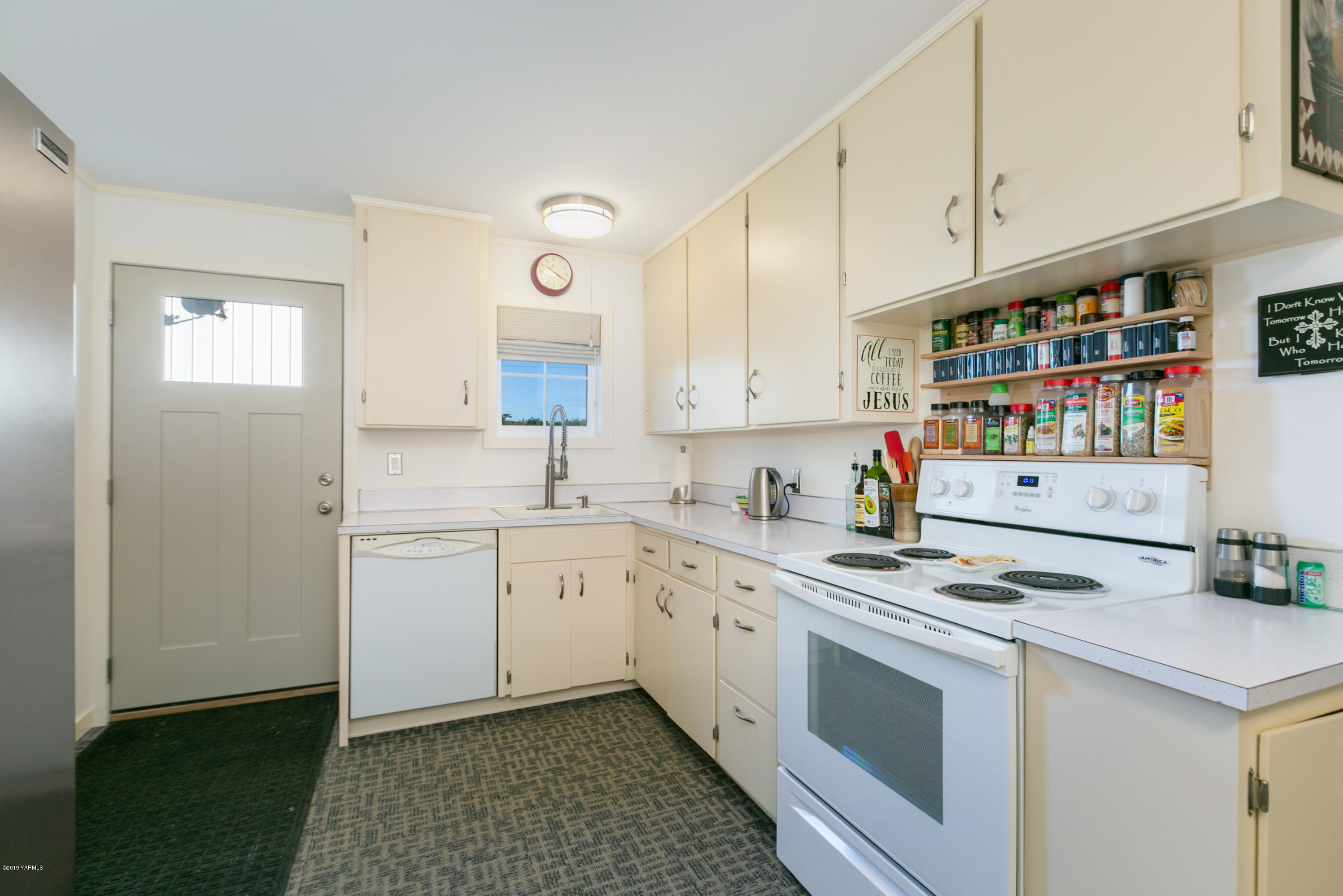 250 Rudd Road Tieton, WA 98947 - Photo 15 of 29 a kitchen with stainless steel appliances granite countertop a sink stove and cabinets