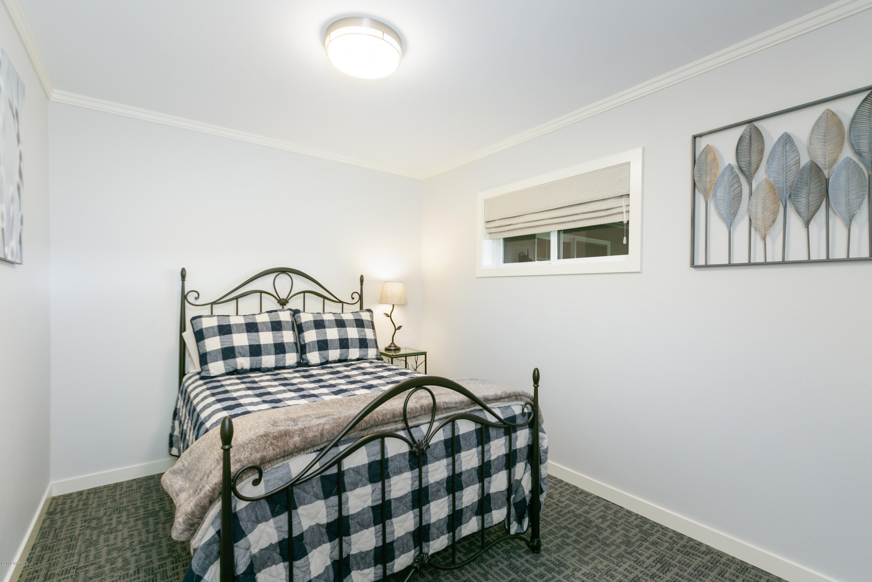 250 Rudd Road Tieton, WA 98947 - Photo 16 of 29 a bedroom with a bed and a window