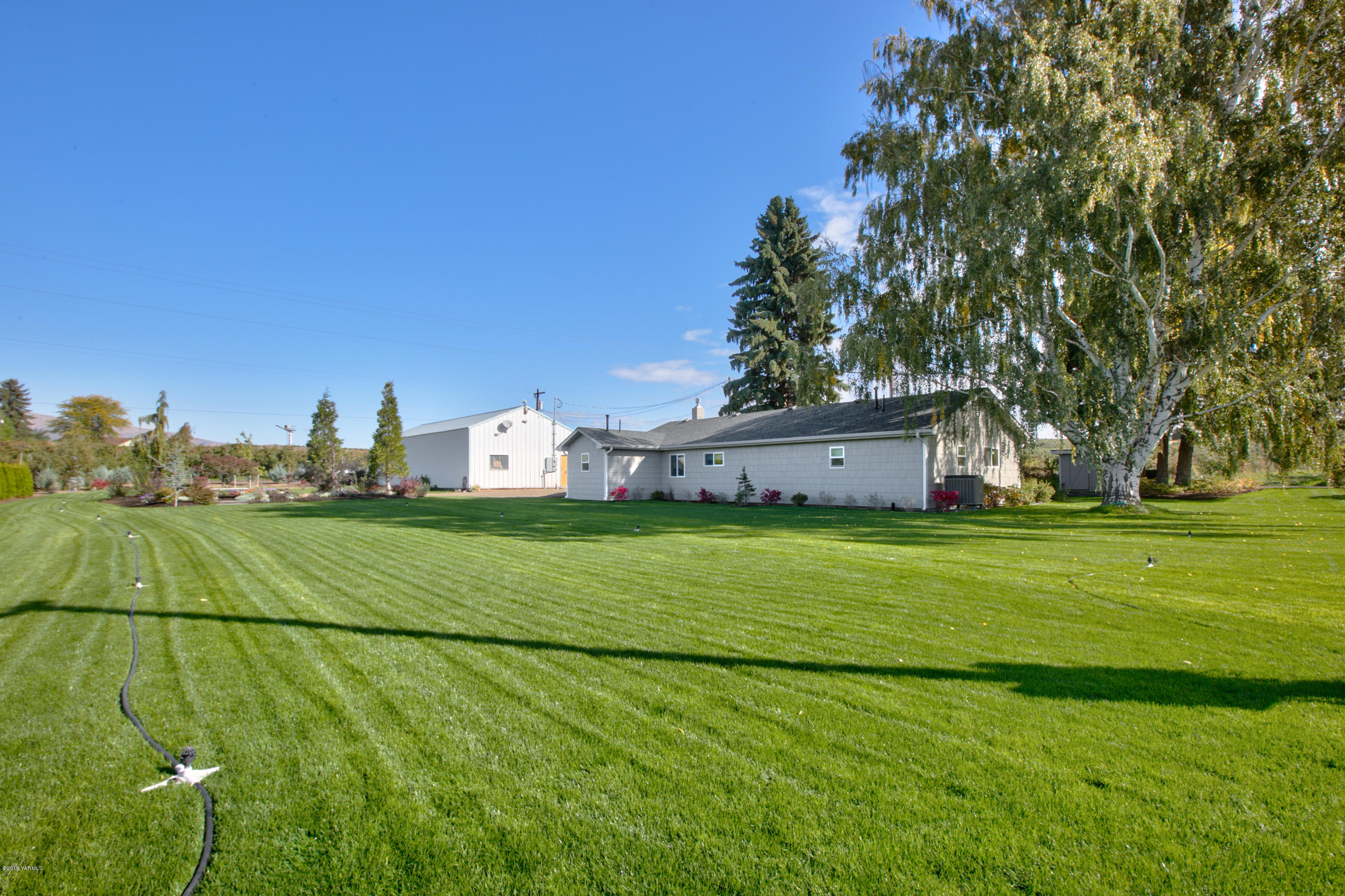 250 Rudd Road Tieton, WA 98947 - Photo 23 of 29 a view of a big yard with large trees