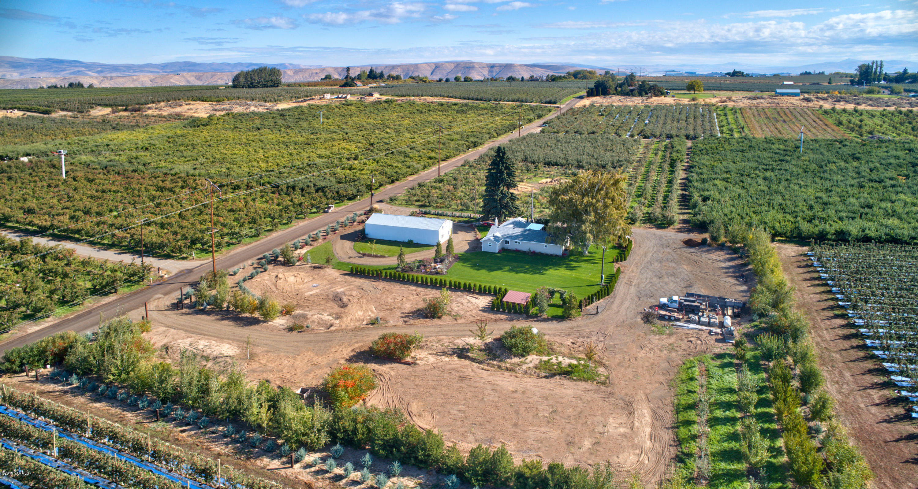 250 Rudd Road Tieton, WA 98947 - Photo 28 of 29 an aerial view of a house with a garden and lake view