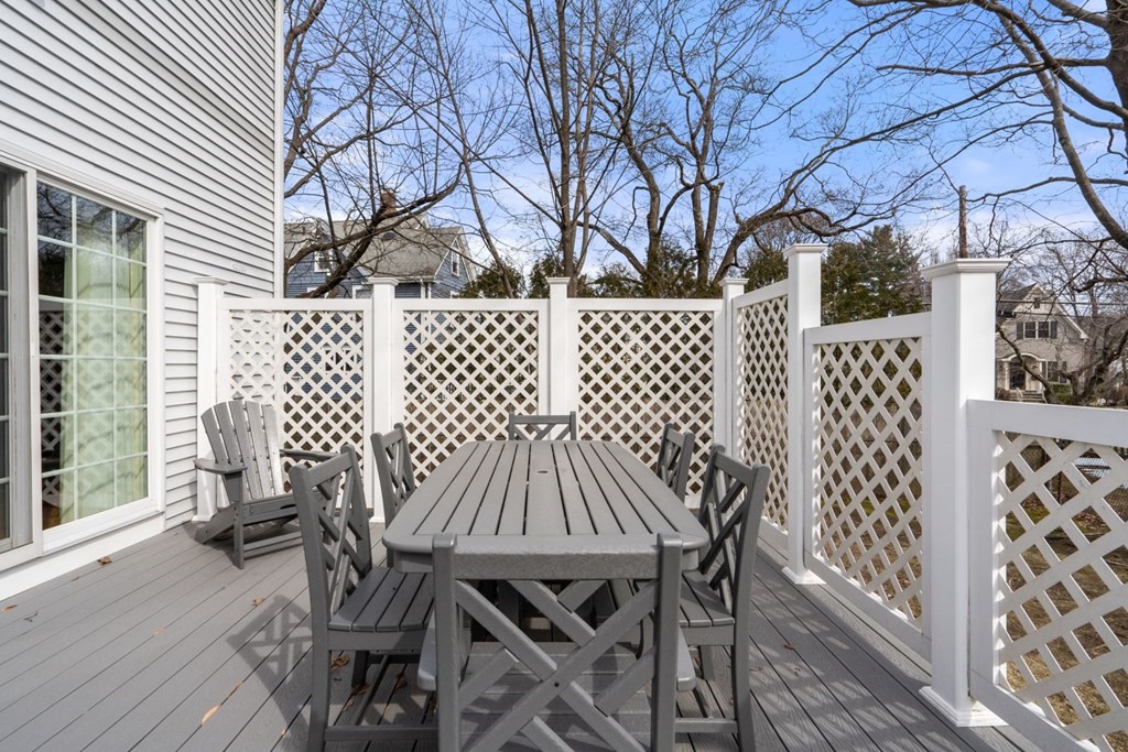 12 Alfreton Road Needham, MA 02494 - Photo 35 of 40 a view of a chairs and table on the wooden deck