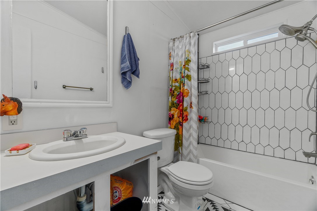 17221 Dodd Lane Southwest Rochester, WA 98579 - Photo 13 of 37 a bathroom with a sink toilet and shower