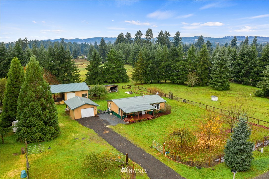 17221 Dodd Lane Southwest Rochester, WA 98579 - Photo 33 of 37 a view of a swimming pool with a yard