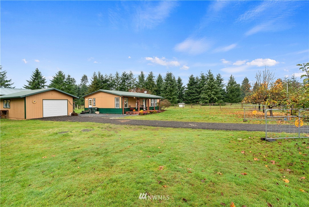 17221 Dodd Lane Southwest Rochester, WA 98579 - Photo 37 of 37 a front view of a house with a yard and a large tree