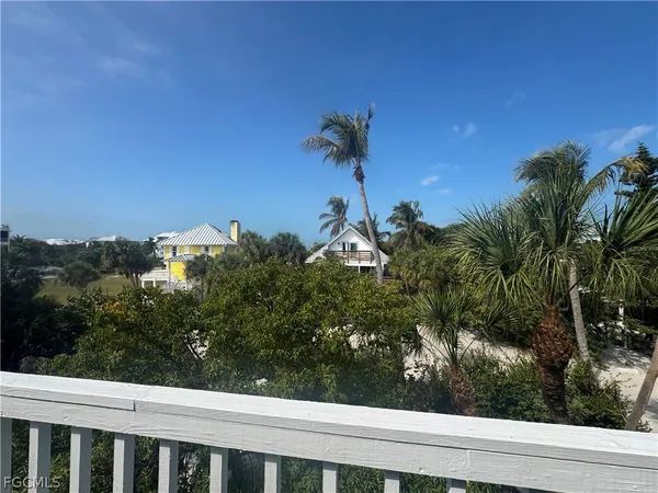 a view of a balcony with a tree