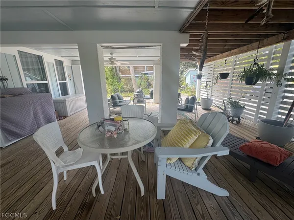 a view of a dining room with furniture window and outside view