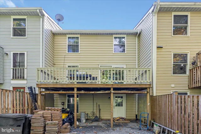 a front view of a house with many windows