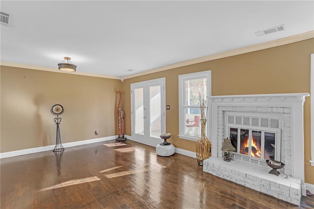 6315 Windsor Trace Drive Peachtree Corners, GA 30092 - Photo 16 of 26 a living room with fireplace furniture and a fireplace
