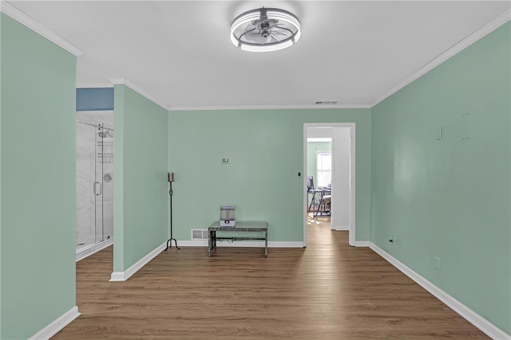 6315 Windsor Trace Drive Peachtree Corners, GA 30092 - Photo 2 of 26 a view of a hallway with wooden floor