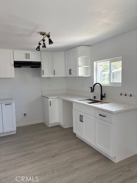 1680 South Tartar Lane, Unit 27 Compton, CA 90221 - Photo 2 of 12 a kitchen with a sink cabinets and window