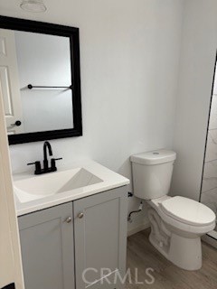 1680 South Tartar Lane, Unit 27 Compton, CA 90221 - Photo 7 of 12 a bathroom with a toilet sink and mirror