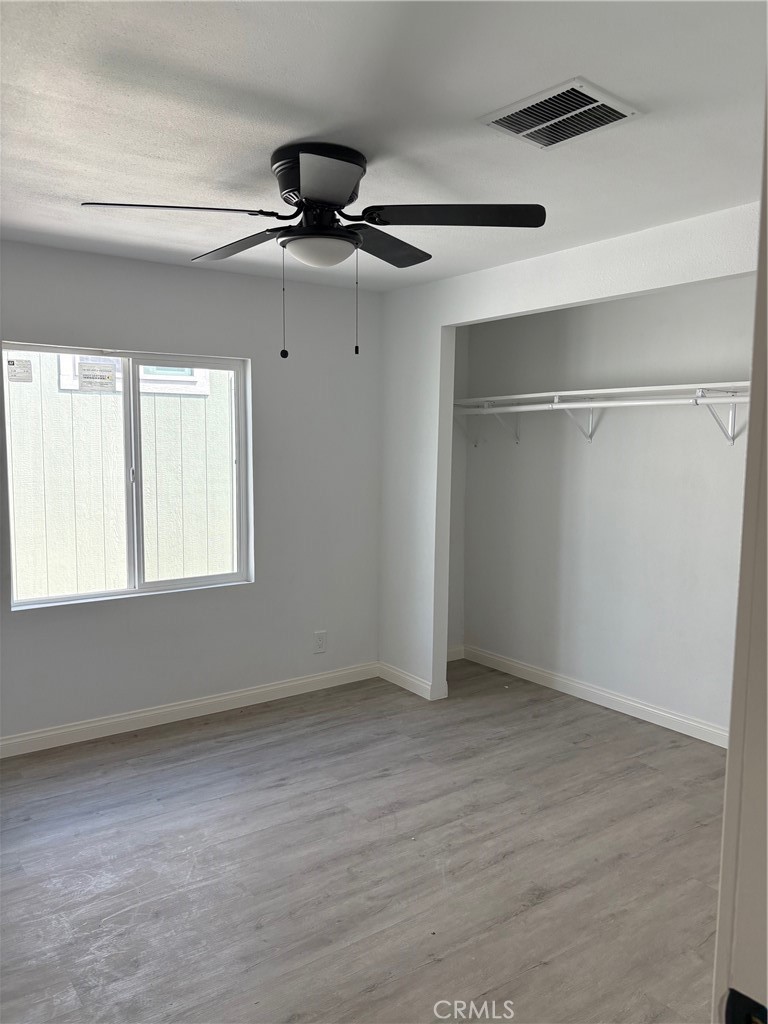 1680 South Tartar Lane, Unit 27 Compton, CA 90221 - Photo 8 of 12 a view of an empty room with a window