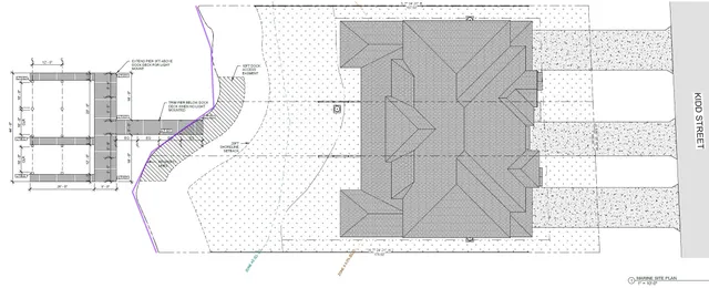 a view of kitchen with white cabinets and refrigerator