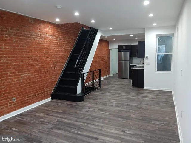 a view of entryway with wooden floor