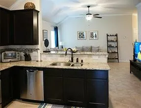 a kitchen with a sink and a refrigerator