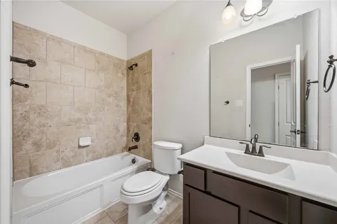 a bathroom with a bathtub and shower