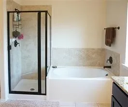 a bathroom with a bathtub and shower