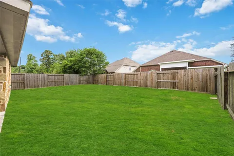 a view of a swimming pool with a yard