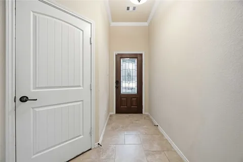 a large kitchen with stainless steel appliances granite countertop a stove a refrigerator and a microwave