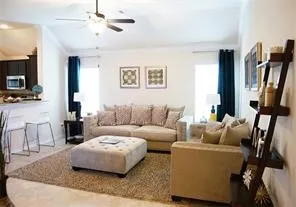 a living room with furniture and a flat screen tv