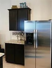 a kitchen with a sink and refrigerator