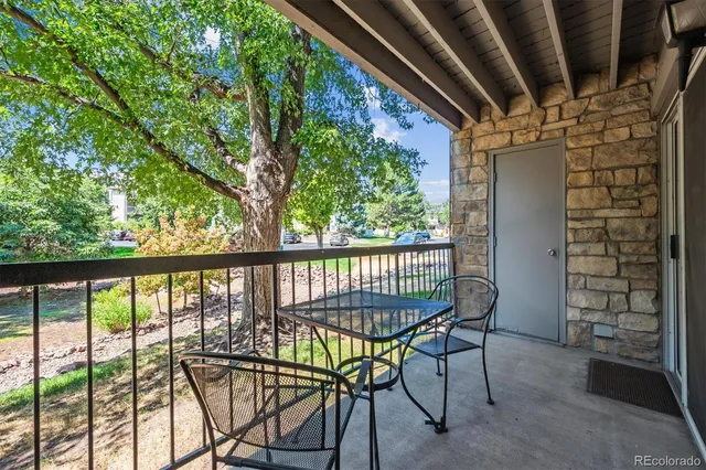 a view of a balcony with chairs