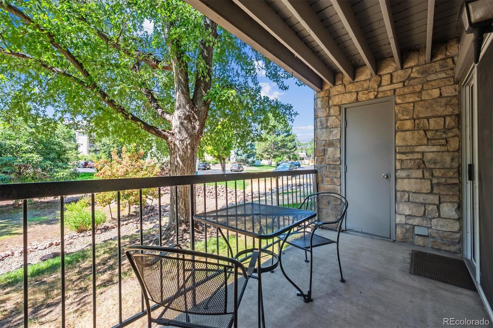2575 South Syracuse Way, Unit L103 Denver, CO 80231 - Photo 17 of 21 a view of a balcony with chairs