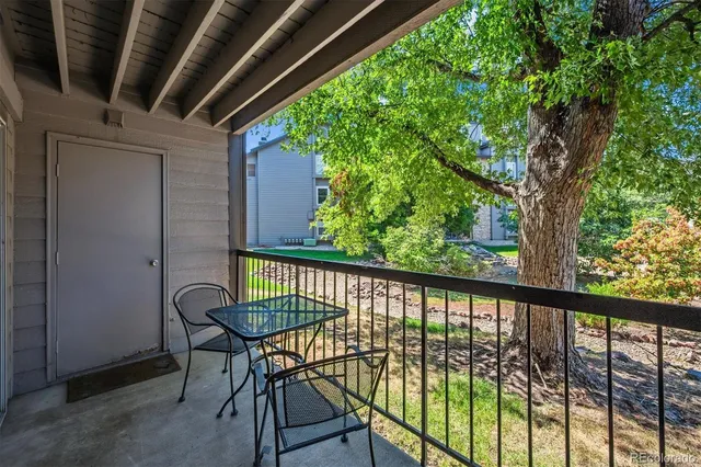 a view of a balcony with furniture