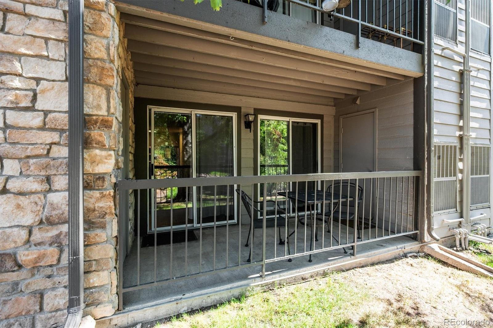 2575 South Syracuse Way, Unit L103 Denver, CO 80231 - Photo 19 of 21 a view of a balcony with floor to ceiling window