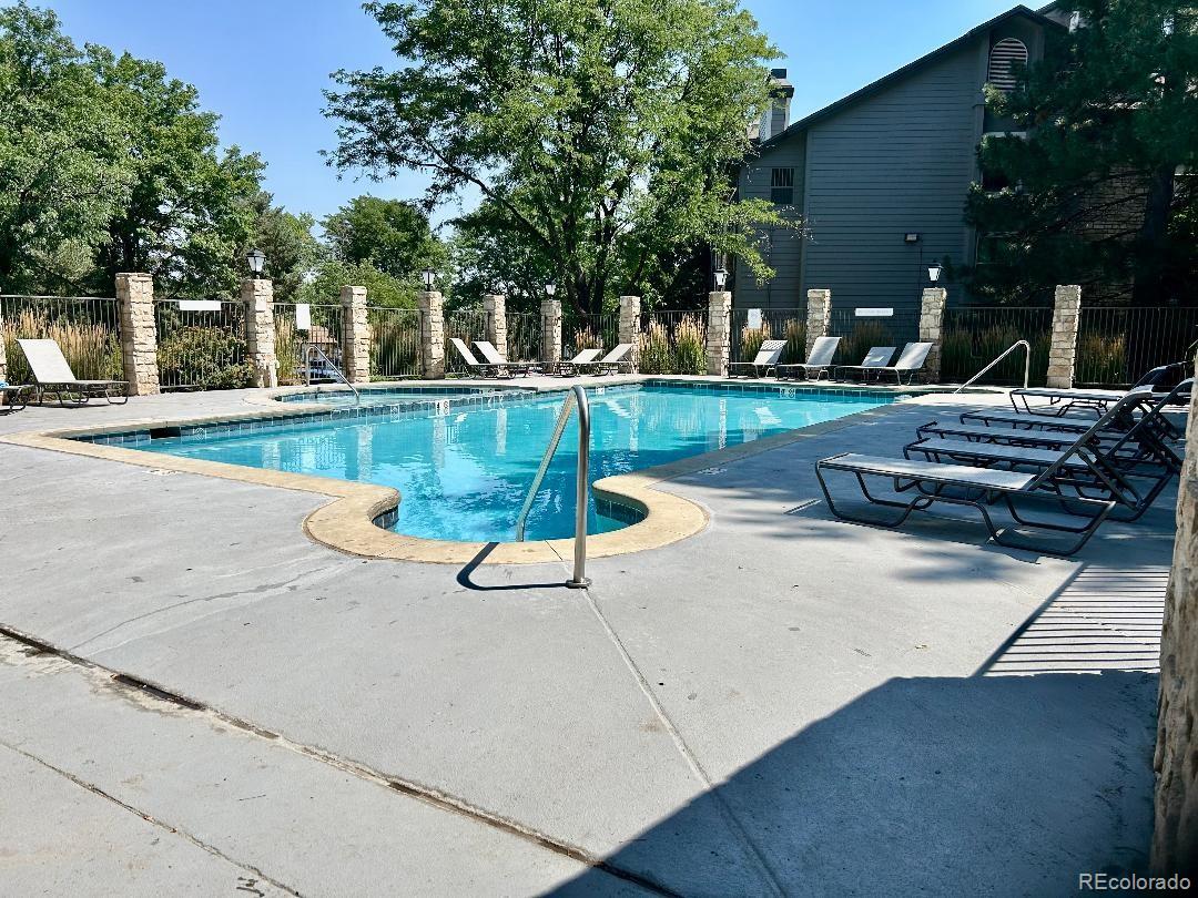 2575 South Syracuse Way, Unit L103 Denver, CO 80231 - Photo 21 of 21 a view of a house with garden and sitting area