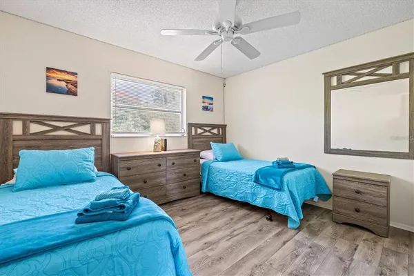 a bedroom with a bed and a dresser