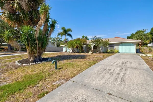 a swimming pool with outdoor seating and yard