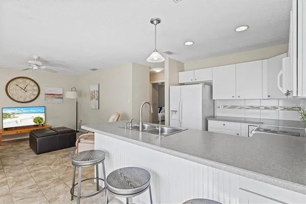 a kitchen with a table and chairs in it