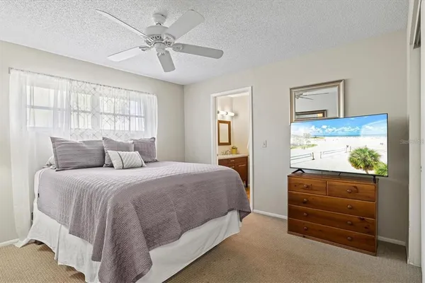 a bedroom with a bed and a dresser