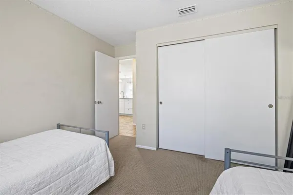 a bedroom with a bed and a shower