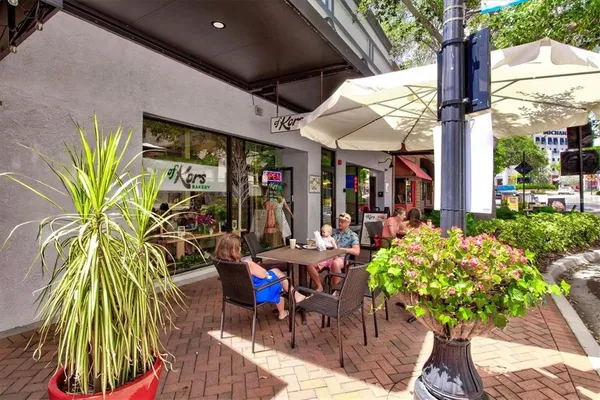 a outdoor dining space with furniture